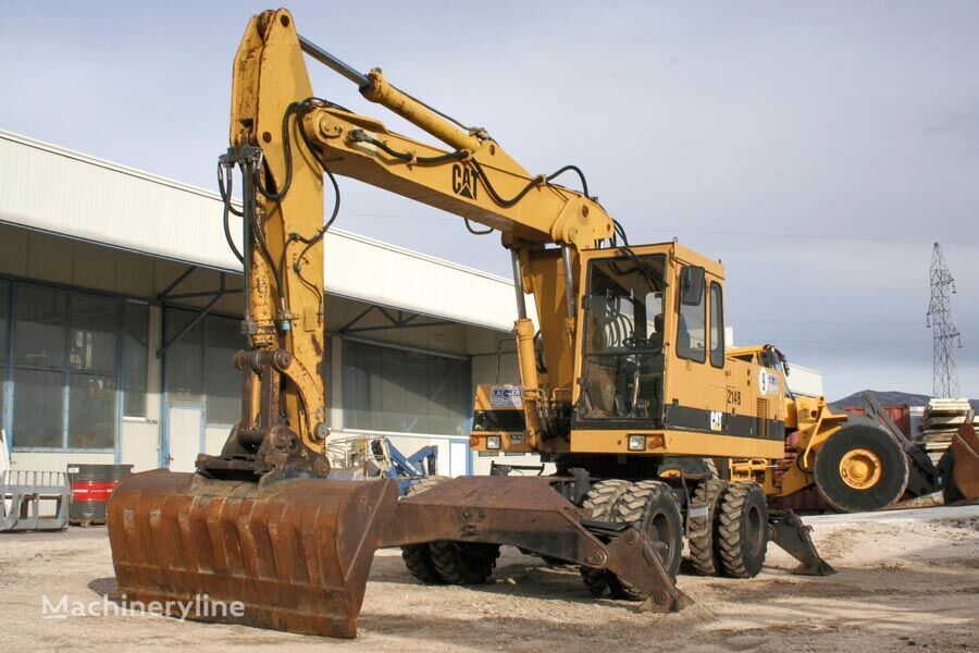 Caterpillar 214B gumikerekes kotró