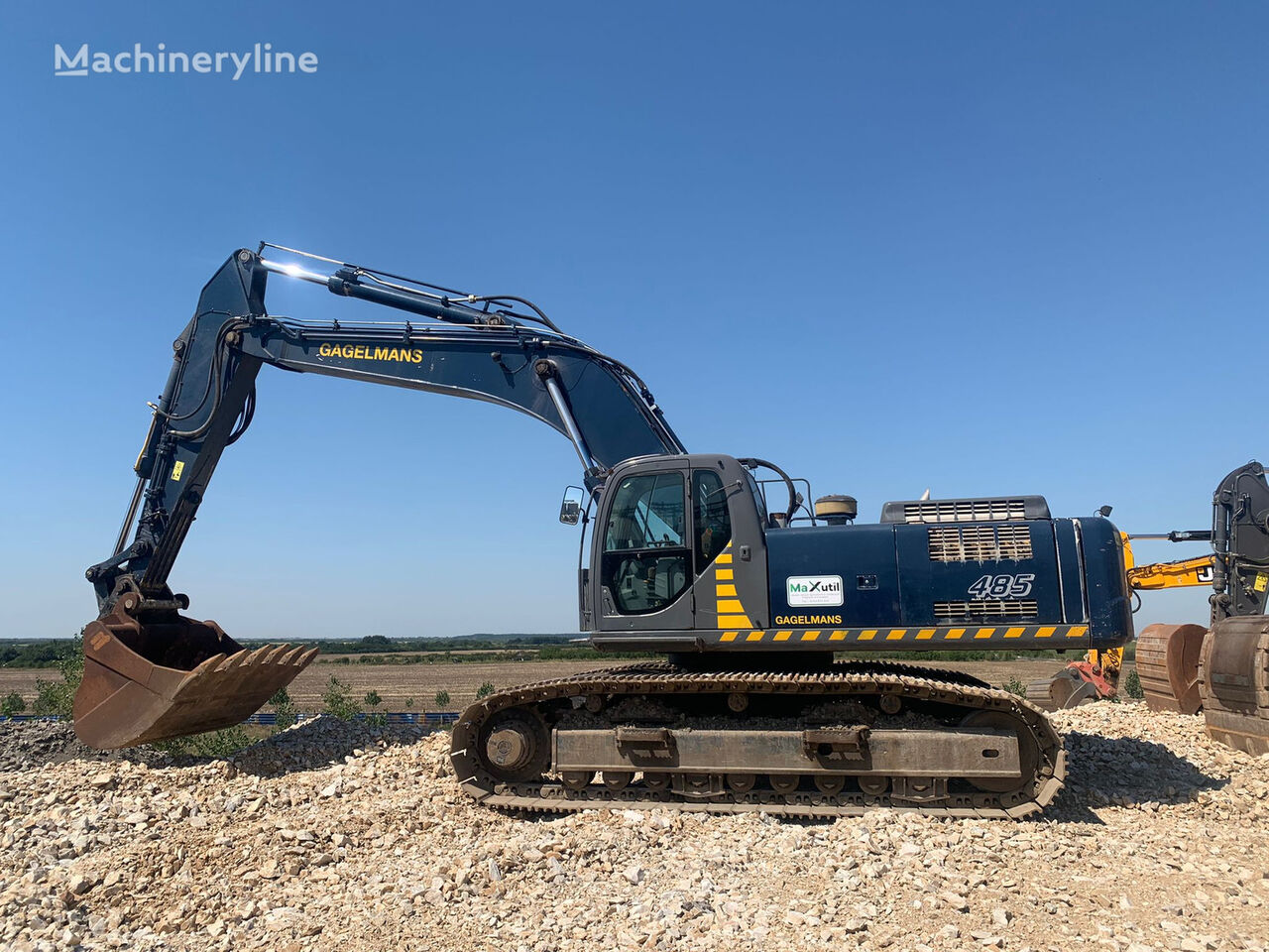 New Holland Kobelco E485 Excavator vödör-lapátkerekes kotrógép